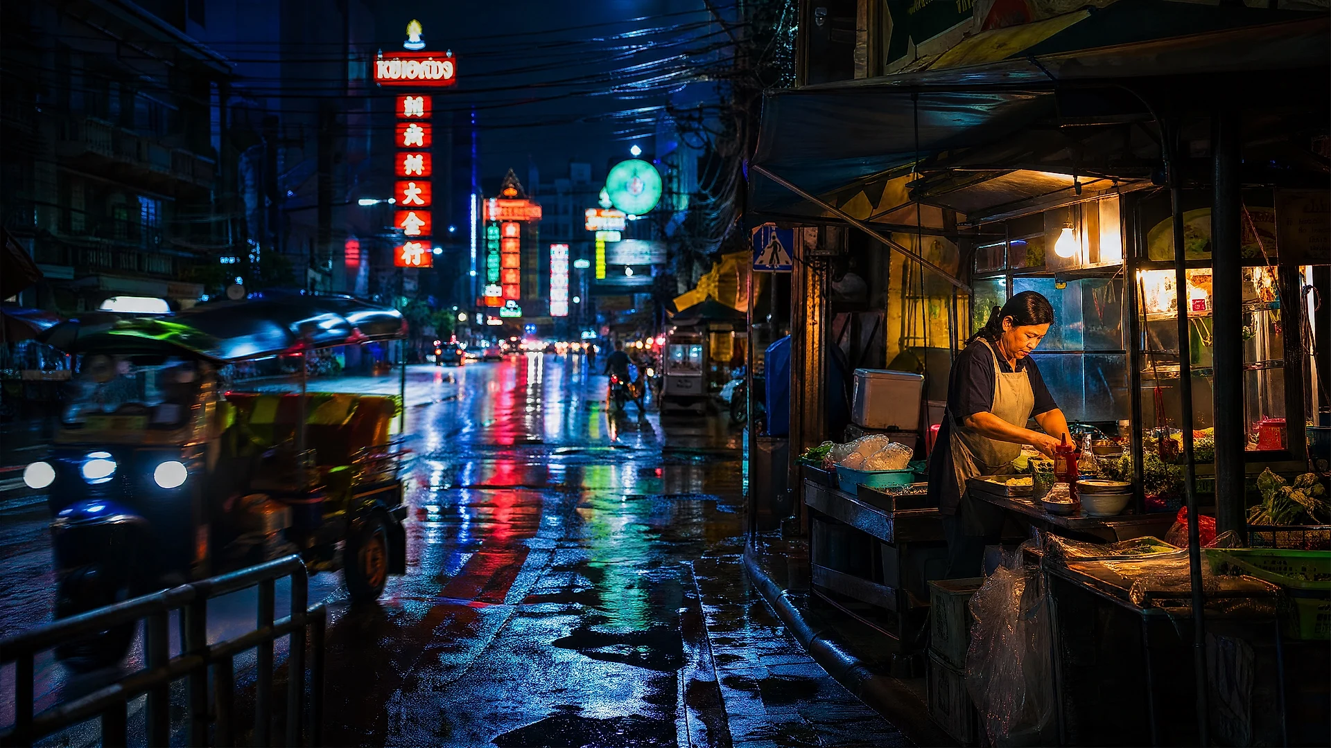 Neon-lit Bangkok street reflected in wet asphalt after rain